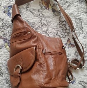 Rioni brown leather sling backpack purse